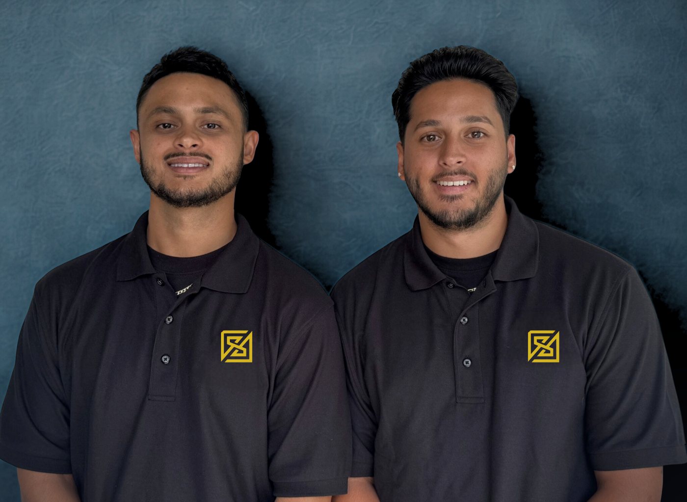 Miles and Chris Choong, the brothers who founded Merchant Samurai, wearing black polos with the gold Merchant Samurai logo